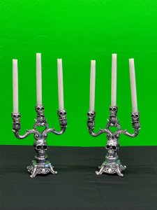 Small silver skull candelabras
